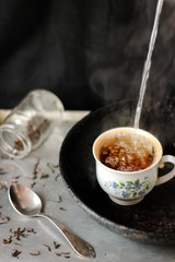Cup with a splash. Hot drink with splash, beverages and refreshment. Copyspace for text. Hot tea