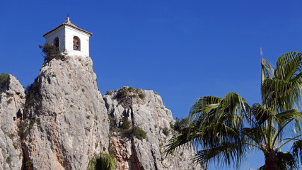 Bell tower of Guadalest castle on top of the rock, Spain.