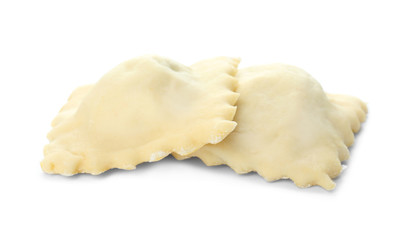 Raw ravioli on white background