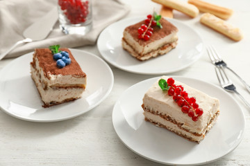 Tasty tiramisu on white table