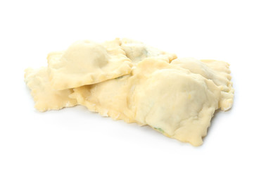 Raw ravioli on white background