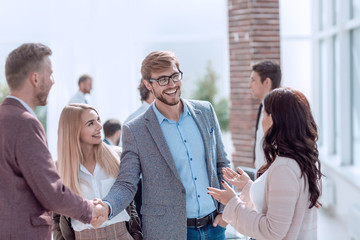 business people greet each other with a handshake.