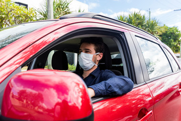 Young driver with face mask