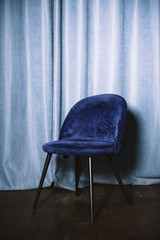 Blue modern chair on blue background