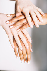 Obraz na płótnie Canvas multiracial hands holding on white background