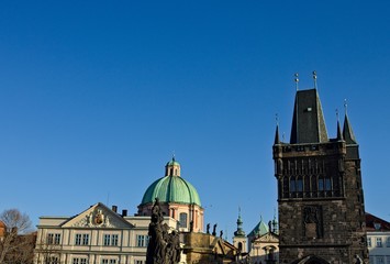 View of the Charles Bridge Tower and the statues on the Charles Bridge (Prague, Czech Republic, Europe)