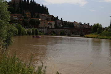 Verona - Adige panorama and rafts on the Adige.