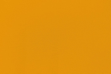 Golden homogeneous background with a textured surface. Gray fabric.