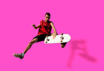 young skateboarder jumps up with his board isolated