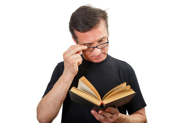 Portrait of a Mature man with glasses and a book