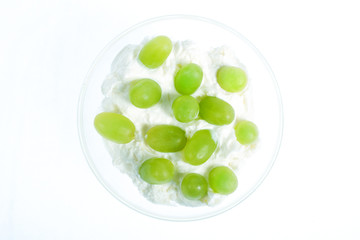 glass bowl with yogurt and green grapes