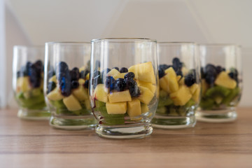 Pieces of fruit in a glass. Diced