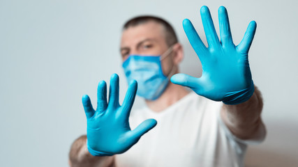 Man In Medical Mask Gesturing Stop Over Gray Background, Panorama