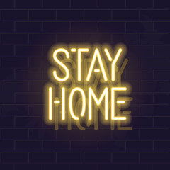 Fototapeta na wymiar Neon stay home typography. Glowing vector motivation typography. Fluorescent letters on dark brick wall background.