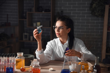 Female alchemist working in laboratory
