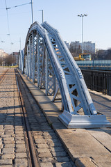 Fototapeta premium Railway blue bridge over the river