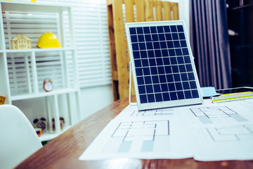 Architectural offiice site desk Solar cell background construction project ideas concept.Renewable energy