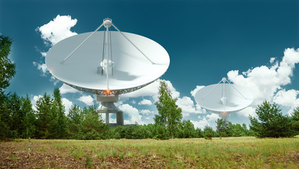 White Radio Telescope, a large satellite dish on a background of blue sky, radar. Technology...