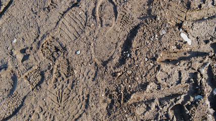 Boot print on the ground.Imprint male boot print on the ground.