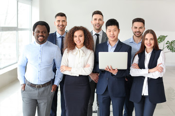 Group of business people with laptop in office. Unity concept