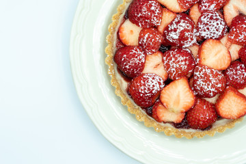 Strawberry tart shot in studio on white background