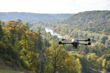 Fototapeta na wymiar black flying drone in sky