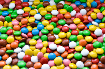 Fototapeta na wymiar Background of sweets, chocolates of different colors