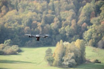 Fototapeta na wymiar black flying drone in sky