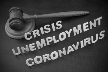 Unemployment and crisis because coronavirus pandemic concept. Judge gavel with words coronavirus, unemployment and crisis.