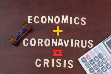 Coronavirus, unemployment and crisis time concept with hourglass and calculator.