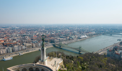 Empty tourist destination in Budapest, Hungary. People stay at home in self quarantine curfew, during the COVID-19 coronavirus.  Liberty Statue, Citadella in abandoned view.