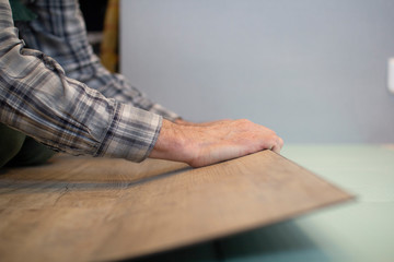Vinyl laminate. Laying of the floor covering.