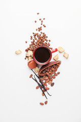 Cup of coffee with roasted beans on white background