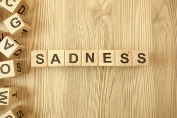 Word sadness from wooden blocks