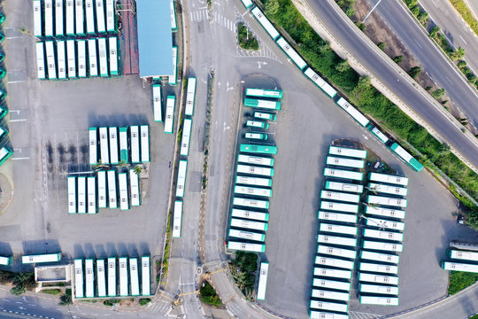 Corona Virus days, Bus terminal at full capacity of parked Buses due to Government lockdown guidelines, aerial view.