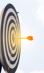 Dart on Dartboard score Achieve winner on target for business concept 