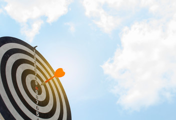 Dart on Dartboard score Achieve winner on target for business concept 