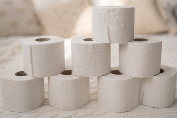 stack of new roll of white toilet paper close up 