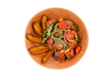  baked potato wedges with meatballs and vegetables in a wooden plate for the restaurant menu