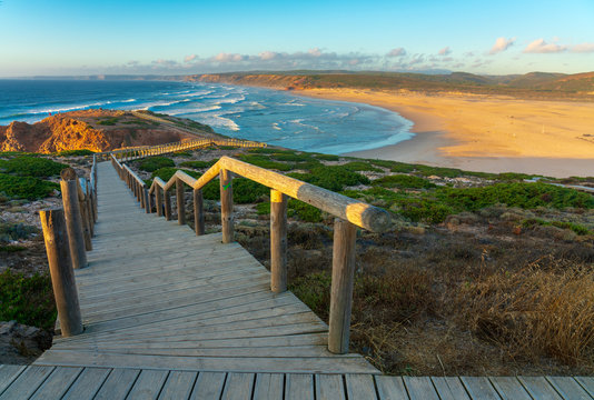 Panoramic view of beach and coastline at sunset in Praia da Bordeira