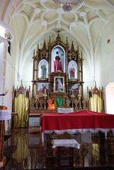 Fototapeta na wymiar Main altar at St. Blaise Catholic Church in Gandaulim, Goa, India