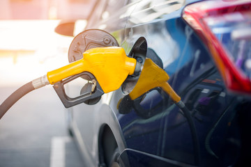 Close up of car is refilling oil fuel in Gas Station