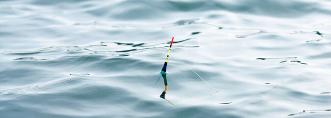 fishing float but water surface © andrii kornev