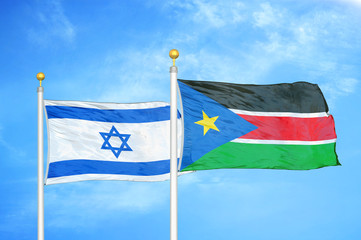 Israel and South Sudan two flags on flagpoles and blue cloudy sky