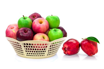 apple fruits in basket isolated on white.