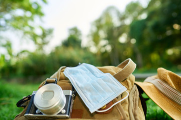                  Prop suitcase with Corona mask with camera and purse                                  
