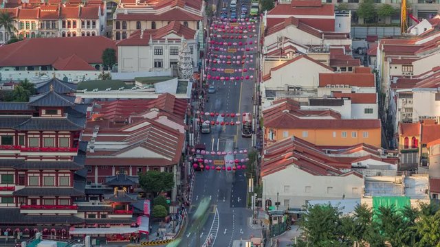 Aerial view of Chinatown with red roofs timelapse, Singapore. Vew from skybridge viewpoint with decorations and traffic on South Bridge road