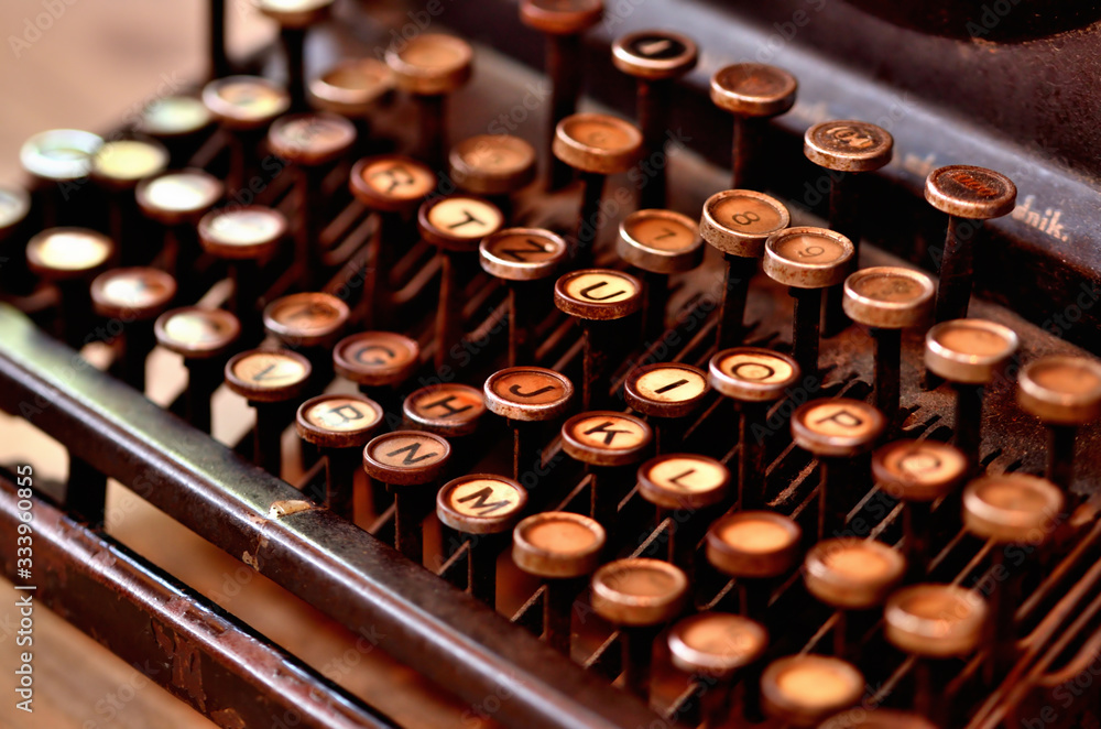 Fototapete close-up of very old antique typewriter keyboard. low depth of field.