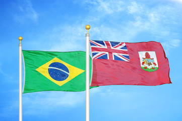 Brazil and Bermuda two flags on flagpoles and blue cloudy sky