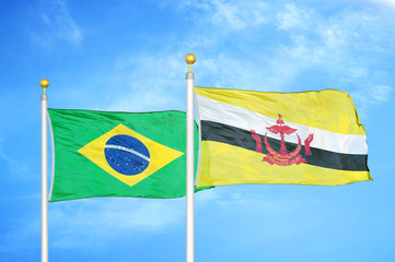 Brazil and Brunei two flags on flagpoles and blue cloudy sky